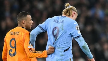 Real Madrid's French forward #09 Kylian Mbappe (L) pull sthe jersey of Manchester City's Norwegian striker #09 Erling Haaland during the UEFA Champions League football match between Manchester City and Real Madrid at the Etihad Stadium in Manchester, north west England, on February 11, 2025. (Photo by Oli SCARFF / AFP)