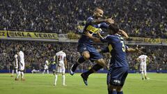 Argentina&#039;s Boca Juniors forward Dario Benedetto (C) celebrates with teammates after scoring agaisnt Colombia&#039;s Deportes Tolima during a Copa Libertadores 2019 group G football match at the &quot;Bombonera&quot; stadium in Buenos Aires, on March 12, 2019. (Photo by JUAN MABROMATA / AFP)