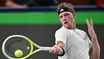 Spain's Alejandro Davidovich Fokina hits a return to Russia's Daniil Medvedev during their men's singles match at the Shanghai Masters tennis tournament in Shanghai on October 6, 2025. (Photo by Hector RETAMAL / AFP)