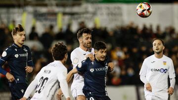 GRAFCVA6582. REQUENA, 01/11/2023.-El jugador de la Real Sociedad, Carlos Fernandez disputa un balón con Joao, del CD Buñol, durante el partido correspondiente a la Copa del Rey jugado en el estadio Tomás Berlanga de Requena, (Valencia) .EFE/ Ana Escobar