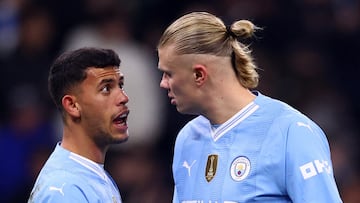 Soccer Football - Champions League - Round of 16 - Second Leg - Manchester City v FC Copenhagen - Etihad Stadium, Manchester, Britain - March 6, 2024 Manchester City's Matheus Nunes speaks to Erling Braut Haaland REUTERS/Carl Recine