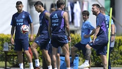 Argentina's forward Lionel Messi (R), midfielder Rodrigo De Paul (2-R), midfielder Leandro Paredes (2-L), and defender Cristian Romero take part in a training session in Ezeiza, Buenos Aires on October 16, 2023, ahead of the FIFA World Cup 2026 qualifier football matches against Peru on October 17 in Lima. (Photo by JUAN MABROMATA / AFP)