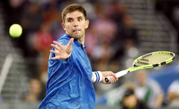 Argentina's tennis player Federico Delbonis returns ball to Croatia's Ivo Karlovic during the Davis Cup World Group final singles match between Croatia and Argentina at the Arena hall in Zagreb, on November 27, 2016. /