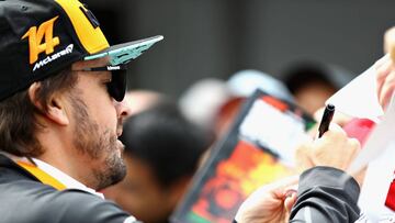 MONTREAL, QC - JUNE 07: Fernando Alonso of Spain and McLaren F1 signs autographs for fans during previews ahead of the Canadian Formula One Grand Prix at Circuit Gilles Villeneuve on June 7, 2018 in Montreal, Canada.   Mark Thompson/Getty Images/AFP
 == FOR NEWSPAPERS, INTERNET, TELCOS &amp; TELEVISION USE ONLY ==