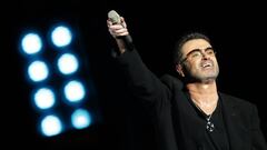 (FILES) This file photo taken on December 01, 2008 shows legendary pop singer George Michael performing in concert at the Zayed Sports City stadium in Abu Dhabi on December 1, 2008. 
 British pop icon George Michael, who was found dead at his home on Christmas Day 2016, died of natural causes, a coroner announced on March 7, 2017. / AFP PHOTO / Karim SAHIB