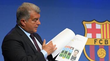 Barcelona's President Joan Laporta presents documents as he addresses a press conference at the Camp Nou stadium in Barcelona on April 17, 2023. - Barcelona have never "done anything" to "obtain some type of sporting advantage," the club's president Joan Laporta said amid investigations into payments made to a former refereeing chief. Laporta told that the allegations of wrongdoing were part of a "smear campaign" against the Catalan side who are currently top of La Liga. (Photo by LLUIS GENE / AFP) (Photo by LLUIS GENE/AFP via Getty Images)