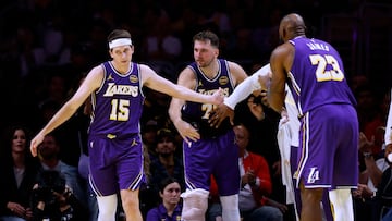 Austin Reaves #15 of the Los Angeles Lakers celebrates his basket and LA Clippers foul with Luka Doncic #77 and LeBron James #23 during a 135-118 Los Angeles Lakers win at Crypto.com Arena on November 25, 2025 in Los Angeles, California.