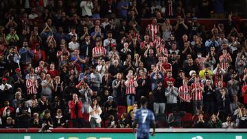 Soccer Football - Premier League - Brentford v Arsenal - Brentford Community Stadium, London, Britain - August 13, 2021 Brentford fans applaud Arsenal's Bukayo Saka as he comes on as a substitute Action Images via Reuters/Peter Cziborra EDITORIAL USE