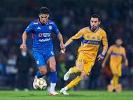 Lorenzo Faravelli (L) of Cruz Azul fights for the ball with Juan Pablo Vigon (R) of Tigres during the semi-finals first leg match between Cruz Azul and Tigres UANL, as part of the Liga BBVA MX, Torneo Apertura 2025 at Olimpico Universitario Stadium, on December 03, 2025 in Mexico City, Mexico.