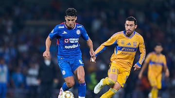 Lorenzo Faravelli (L) of Cruz Azul fights for the ball with Juan Pablo Vigon (R) of Tigres during the semi-finals first leg match between Cruz Azul and Tigres UANL, as part of the Liga BBVA MX, Torneo Apertura 2025 at Olimpico Universitario Stadium, on December 03, 2025 in Mexico City, Mexico.