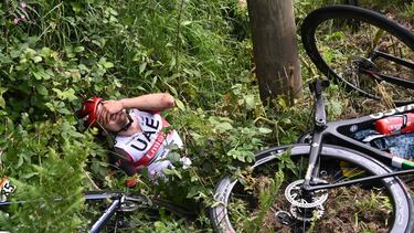 Cycling - Tour de France - Stage 1 - Brest to Landerneau - France - June 26, 2021 UAE Team Emirates rider Marc Hirschi of Switzerland reacts after a crash REUTERS/Anne-Christine Poujoulat