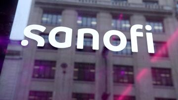 (FILES) This file photo taken on February 4, 2022 shows in a reflection the new logo of French pharmaceutical group Sanofi which is presented on the day of the group&#039;s 2021 full year results at Sanofi headquarters in Paris. - The French pharmaceutica