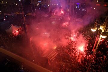 Croatia's supporters celebrate after winning the Russia 2018 World Cup semi-final football match between Croatia and England, at the main square in Zagreb on July 11, 2018.  / AFP PHOTO / Denis Lovrovic