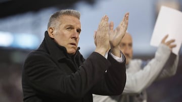 FILE - In this March 24, 2018, file photo, Sporting Kansas City&#039;s Peter Vermes acknowledges fans as he takes the pitch to lead his team against the Colorado Rapids in an MLS soccer match in Commerce City, Colo.  Sporting Kansas City manager and technical director Peter Vermes has signed a contract extension that could keep him with the Major League Soccer club through the 2023 season.
 Sporting KC announced the deal in a statement Monday, May 7, 2018. (AP Photo/David Zalubowski, File)