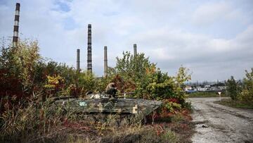 A Ukrainian serviceman sits atop a BMP infantry fighting vehicle in Kramatorsk, eastern Ukraine, on October 2, 2022, amid the Russian invasion of Ukraine. (Photo by Juan BARRETO / AFP) (Photo by JUAN BARRETO/AFP via Getty Images)