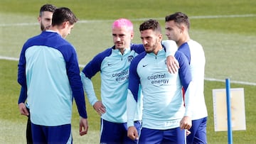 Griezmann y Koke, en la sesión del Atlético esta mañana en el Cerro.