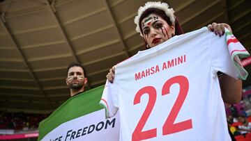 An Iranian fan holds a jersey in memory of Mahsa Amini, inside the stadium before the matc against Wales last week.