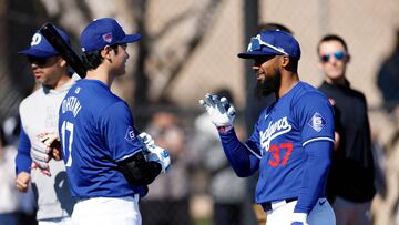 GLENDALE, ARIZONA - FEBRUARY 14: Shohei Ohtani #17 of the Los Angeles Dodgers talks with Teoscar Hern�ndez #37 during workouts at Camelback Ranch on February 14, 2024 in Glendale, Arizona.   Chris Coduto/Getty Images/AFP (Photo by Chris Coduto / GETTY IMAGES NORTH AMERICA / Getty Images via AFP)