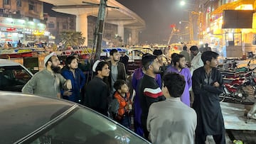 People come out of a restaurant after a tremor was felt in Lahore, Pakistan March 21, 2023.