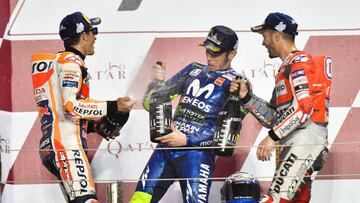 QTR 02. Doha (Qatar), 18/03/2018.- Second placed Spanish MotoGP rider Marc Marquez (L) of Repsol Honda Team, first placed Italian MotoGP rider Andrea Dovizioso (R) of Ducati Team and third placed Italian MotoGP rider Valentino Rossi (C) of Movistar Yamaha