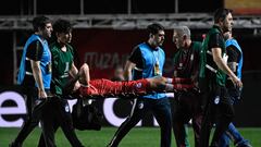 Argentinos Juniors' defender Luciano Sanchez is carried out on a stretcher after being injured during the Copa Libertadores round of 16 first leg football match between Argentina's Argentinos Juniors and Brazil's Fluminense at the Diego Armando Maradona stadium in Buenos Aires, on August 1, 2023. (Photo by Luis ROBAYO / AFP)