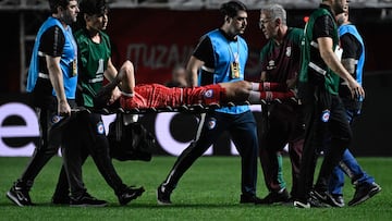 Argentinos Juniors' defender Luciano Sanchez is carried out on a stretcher after being injured during the Copa Libertadores round of 16 first leg football match between Argentina's Argentinos Juniors and Brazil's Fluminense at the Diego Armando Maradona stadium in Buenos Aires, on August 1, 2023. (Photo by Luis ROBAYO / AFP)