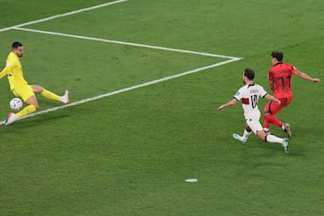 South Korea's midfielder #11 Hwang Hee-chan scores his team's second goal during the Qatar 2022 World Cup Group H football match between South Korea and Portugal at the Education City Stadium in Al-Rayyan, west of Doha on December 2, 2022. (Photo by JACK GUEZ / AFP)