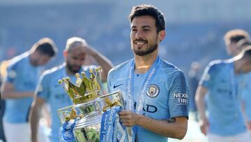 BRIGHTON, ENGLAND - MAY 12: David Silva of Manchester City celebrates with the Premier League Trophy after winning the title following the Premier League match between Brighton & Hove Albion and Manchester City at American Express Community Stadium on