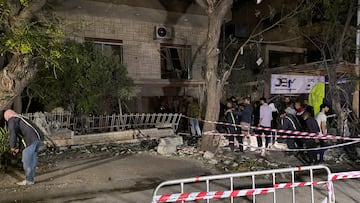 People stand at the site of an Israeli airstrike that targeted a residential building in the Mezzah suburb in western Damascus, according to Syrian state media, Syria October 2, 2024. REUTERS/Firas Makdesi