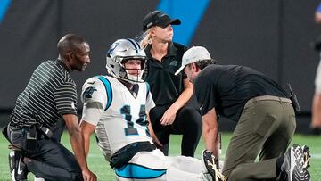 Trainers attend to Carolina Panthers quarterback Sam Darnold during the second half against the Buffalo Bills at Bank of America Stadium.