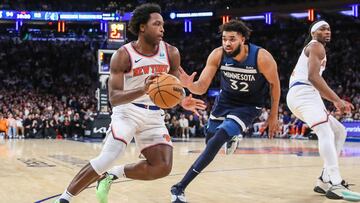 Jan 1, 2024; New York, New York, USA;  New York Knicks forward OG Anunoby (8) looks to drive past Minnesota Timberwolves center Karl-Anthony Towns (32) in the fourth quarter at Madison Square Garden. Mandatory Credit: Wendell Cruz-USA TODAY Sports