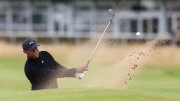 Woods of the USA playing out of a bunker on the 16th hole during a practice round for the Open Golf Championships 2024
