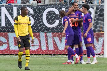 Liverpool's Virgil van Dijk (2nd R) celebrates after scoreing a goal from a header on Borussia Dortmund during the 2018 International Champions Cup at Bank of America Stadium in Charlotte, North Carolina, on July 22, 2018. / AFP PHOTO / JIM WATSON