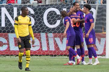 Liverpool's Virgil van Dijk (2nd R) celebrates after scoreing a goal from a header on Borussia Dortmund during the 2018 International Champions Cup at Bank of America Stadium in Charlotte, North Carolina, on July 22, 2018.  / AFP PHOTO / JIM WATSON