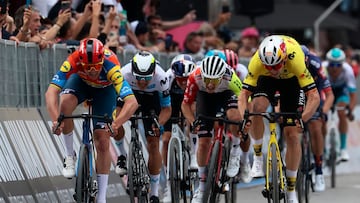 Lidl-Trek's Danish rider Mads Pedersen (L), next to Team Visma-Lease a Bike's Belgian rider Wout Van Aert (R), sprints to win the first stage of the 108th Giro d'Italia cycling race, 160km from Durres to Tirana in Albania, on May 9, 2025. (Photo by Luca Bettini / AFP)