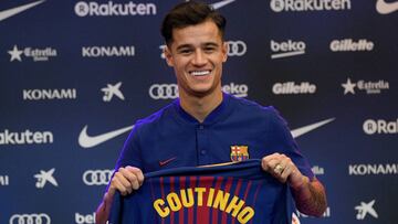BARCELONA, SPAIN - JANUARY 08: New Barcelona signing Philippe Coutinho poses for a photograph with his new shirt as he is unveiled at Camp Nou on January 8, 2018 in Barcelona, Spain. The Brazilian player signed from Liverpool, has agreed a deal with the
