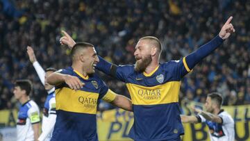Boca Juniors' Daniele De Rossi, right, celebrates his goal against Almagro with teammate Ramon Abila during the "Copa Argentina" local tournament in La Plata, Argentina, Tuesday, Aug. 13, 2019. (AP Photo/Ignacio Amiconi)