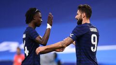 France&#039;s forward Olivier Giroud (R) is congratulated by France&#039;s Eduardo Camavinga after scoring a goal during the International friendly football match between France and Ukraine, on October 7, 2020 in Saint-Denis, outside Paris. (Photo by FRAN
