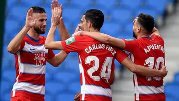SAN SEBASTIAN, SPAIN - JULY 10: Antonio Puertas of Granada is congratulated after he scores the opening goal during the Liga match between Real Sociedad and Granada CF at Estadio Anoeta on July 10, 2020 in San Sebastian, Spain. (Photo by Juan Manuel Serra
