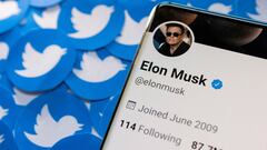 Elon Musk's Twitter profile is seen on a smartphone placed on printed Twitter logos in this picture illustration taken April 28, 2022.