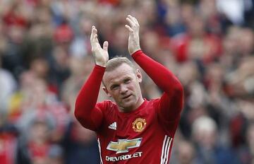 Rooney applauds fans as he is substituted against Crystal Palace on Sunday.