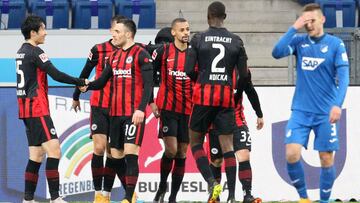 Frankfurt's players celebrate teammate Frankfurt's Portuguese forward Andre Silva (hidden) scoring the 3-1 goal during the German first division Bundesliga football match between TSG 1899 Hoffenheim and Eintracht Frankfurt in Sinsheim, on Februa