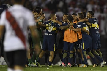 Boca Juniors' footballers celebrate after defeating 2-1 River Plate in the Superliga first division tournament derby match at Monumental stadium in Buenos Aires, Argentina, on November 5, 2017. 