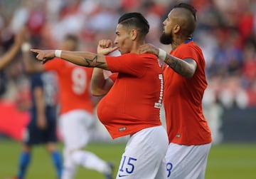 Mar 26, 2019; Houston, TX, USA; Chile midfielder Arturo Vidal (8) celebrates defender Oscar Opazo (15) goal against the United States of America  in the first half during an international friendly soccer match at BBVA Compass Stadium. Mandatory Credit: Thomas B. Shea-USA TODAY Sports