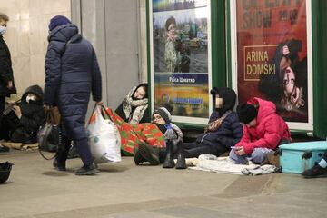 People take shelter from possible Russian air attacks in a Kyiv underground station.