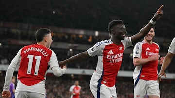 Arsenal's English midfielder #07 Bukayo Saka celebrates scoring the team's second goal with Arsenal's Brazilian midfielder #11 Gabriel Martinelli during the English Premier League football match between Arsenal and Fulham at the Emirates Stadium in London on April 1, 2025. (Photo by Glyn KIRK / AFP) / RESTRICTED TO EDITORIAL USE. No use with unauthorized audio, video, data, fixture lists, club/league logos or 'live' services. Online in-match use limited to 120 images. An additional 40 images may be used in extra time. No video emulation. Social media in-match use limited to 120 images. An additional 40 images may be used in extra time. No use in betting publications, games or single club/league/player publications. /