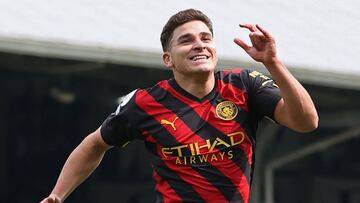 Manchester City's Argentinian striker Julian Alvarez celebrates after scoring their second goal during the English Premier League football match between Fulham and Manchester City at Craven Cottage in London on April 30, 2023. (Photo by ADRIAN DENNIS / AFP) / RESTRICTED TO EDITORIAL USE. No use with unauthorized audio, video, data, fixture lists, club/league logos or 'live' services. Online in-match use limited to 120 images. An additional 40 images may be used in extra time. No video emulation. Social media in-match use limited to 120 images. An additional 40 images may be used in extra time. No use in betting publications, games or single club/league/player publications. / 