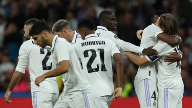 Real Madrid's Croatian midfielder Luka Modric (R) celebrates with teammates after scoring his team's first goal during the UEFA Champions League 1st round day 6 Group F football match between Real Madrid CF and Celtic FC at the Santiago Bernabeu stadium in Madrid on November 2, 2022. (Photo by Thomas COEX / AFP) (Photo by THOMAS COEX/AFP via Getty Images)