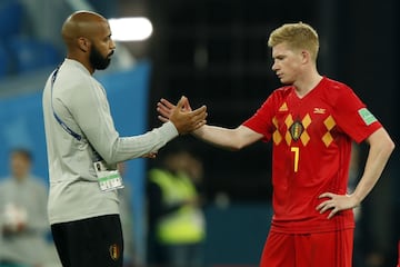 Henry consoles Kevin de Bruyne after Belgium's semi-final defeat.