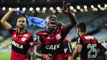 Vinicius Junior, center, Romulo, left, and Felipe Vizeu of Flamengo celebrate after the Copa Sudamericana soccer match against Fluminense, at the Maracana stadium, in Rio de Janeiro, Brazil, on Wednesday, Nov.1, 2017. (AP Photo/Bruna Prado)